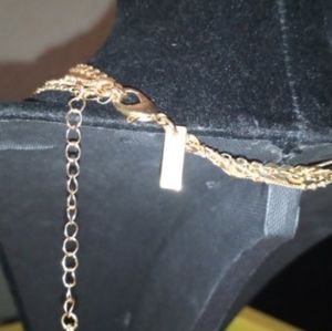 4 strained gold tone necklace.
